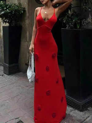 Deep red cami gown with embroidered rose appliqués and a plunging neckline.