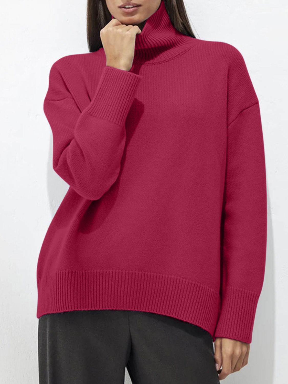 Relaxed fit ribbed turtleneck sweater in cerise acrylic with ribbed cuffs and hem.