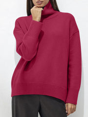 Relaxed fit ribbed turtleneck sweater in cerise acrylic with ribbed cuffs and hem.