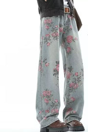 Floral print oversized wide-leg jeans in light wash denim with pink floral pattern.