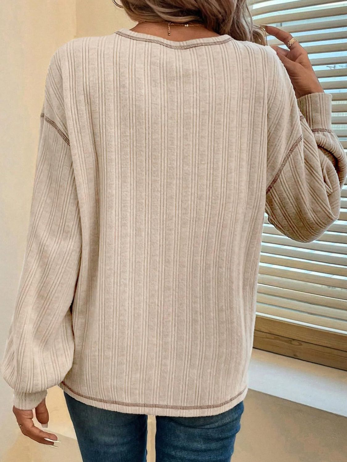 Ribbed knit sweater in Dust Storm with contrast stitching and balloon sleeves.