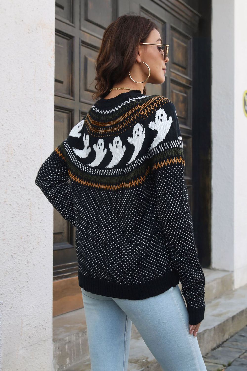 Spooky jacquard knit crewneck sweater in black with white ghost pattern and fair isle detail.