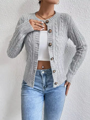 Gray cable-knit button-front cardigan with round neckline and tortoise buttons.