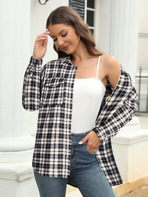 Plaid button-up shirt in black and white with chest pockets, worn open over a white cami.