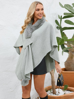 Gray faux fur collar wrap poncho with tie detail and pom-pom accent.