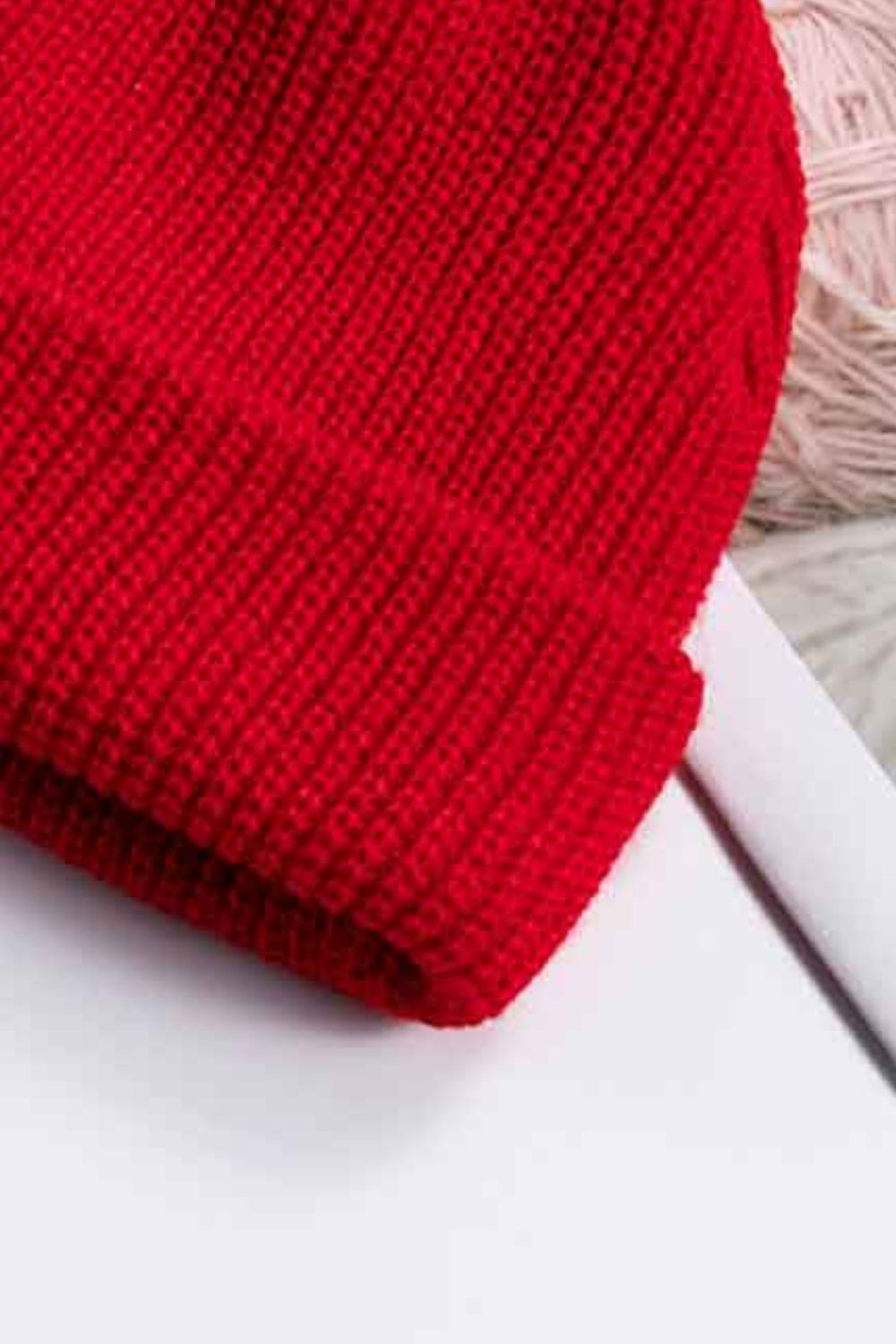Red ribbed knit beanie with turn-up cuff detail