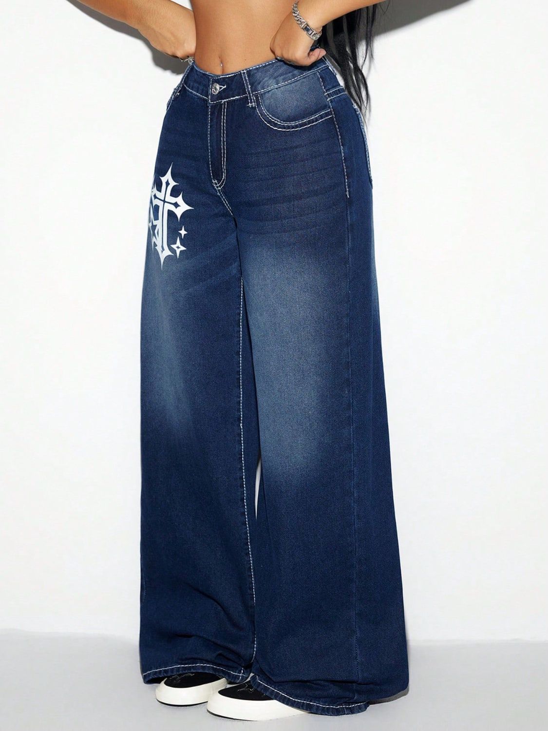 Dark wash cotton palazzo jeans with white cross graphic detail and contrast stitching.