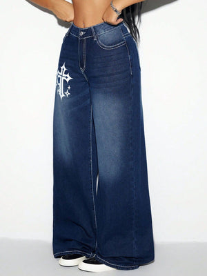 Dark wash cotton palazzo jeans with white cross graphic detail and contrast stitching.