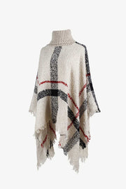 Beige plaid turtleneck cape with fringe detail and textured acrylic knit.