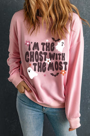 Blush pink crewneck sweatshirt with a spooky ghost and bat graphic and text that reads "I'm the ghost with the most.