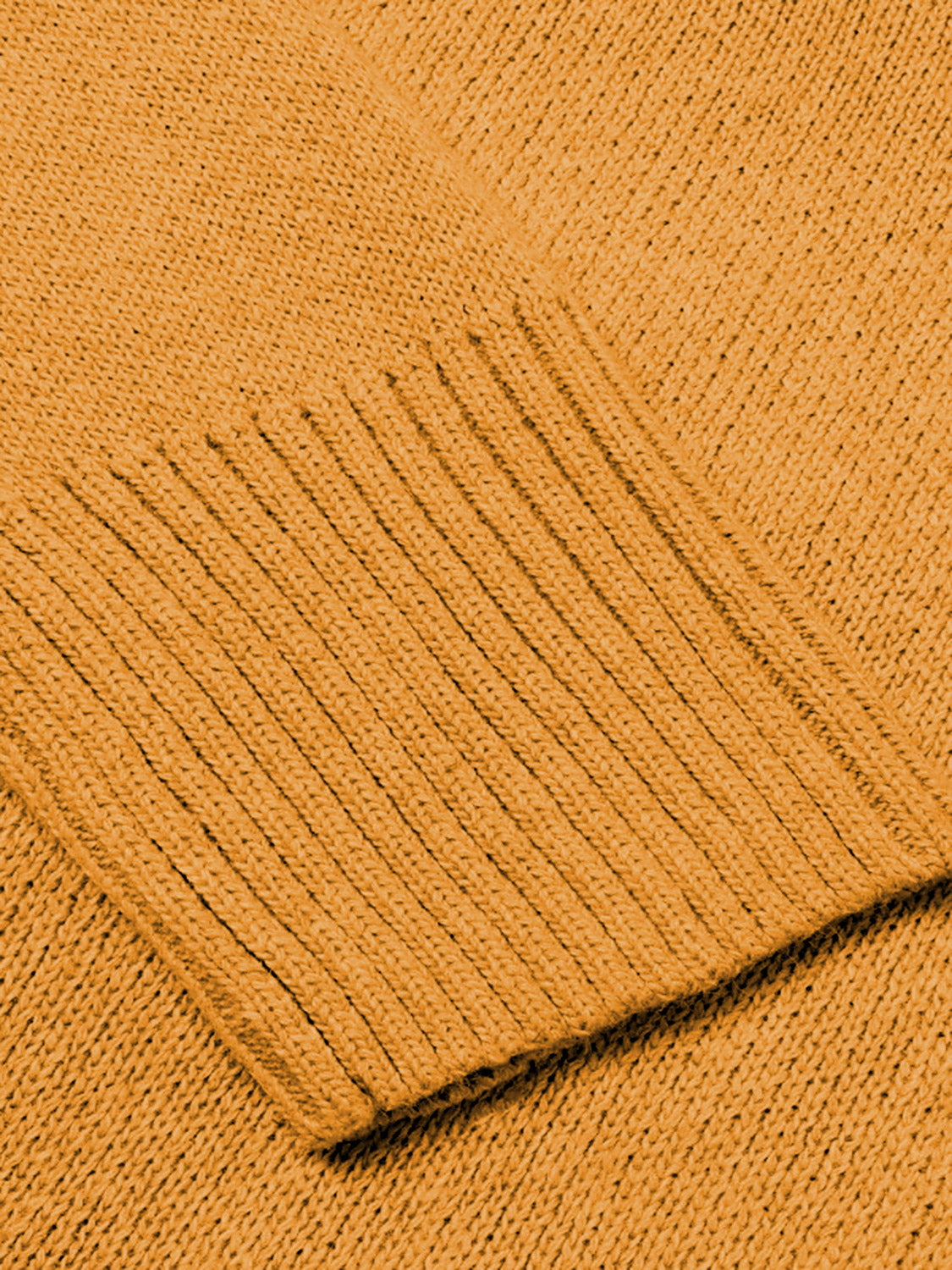 Ribbed trim V-neck knit sweater in Sherbet with a close-up view of the ribbed cuff detail.