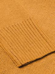 Ribbed trim V-neck knit sweater in Sherbet with a close-up view of the ribbed cuff detail.