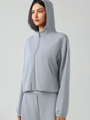 Gray cropped active hoodie with zip front, raglan sleeves, and pockets