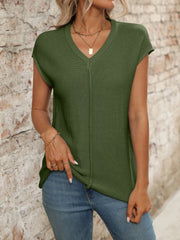 Moss green seamed knit sleeveless V-neck top with a vertical seam detail.