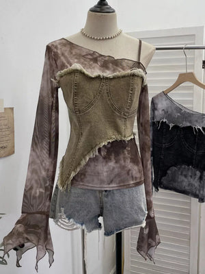 Edgy asymmetrical t-shirt with denim bustier overlay and sheer butterfly print sleeves.