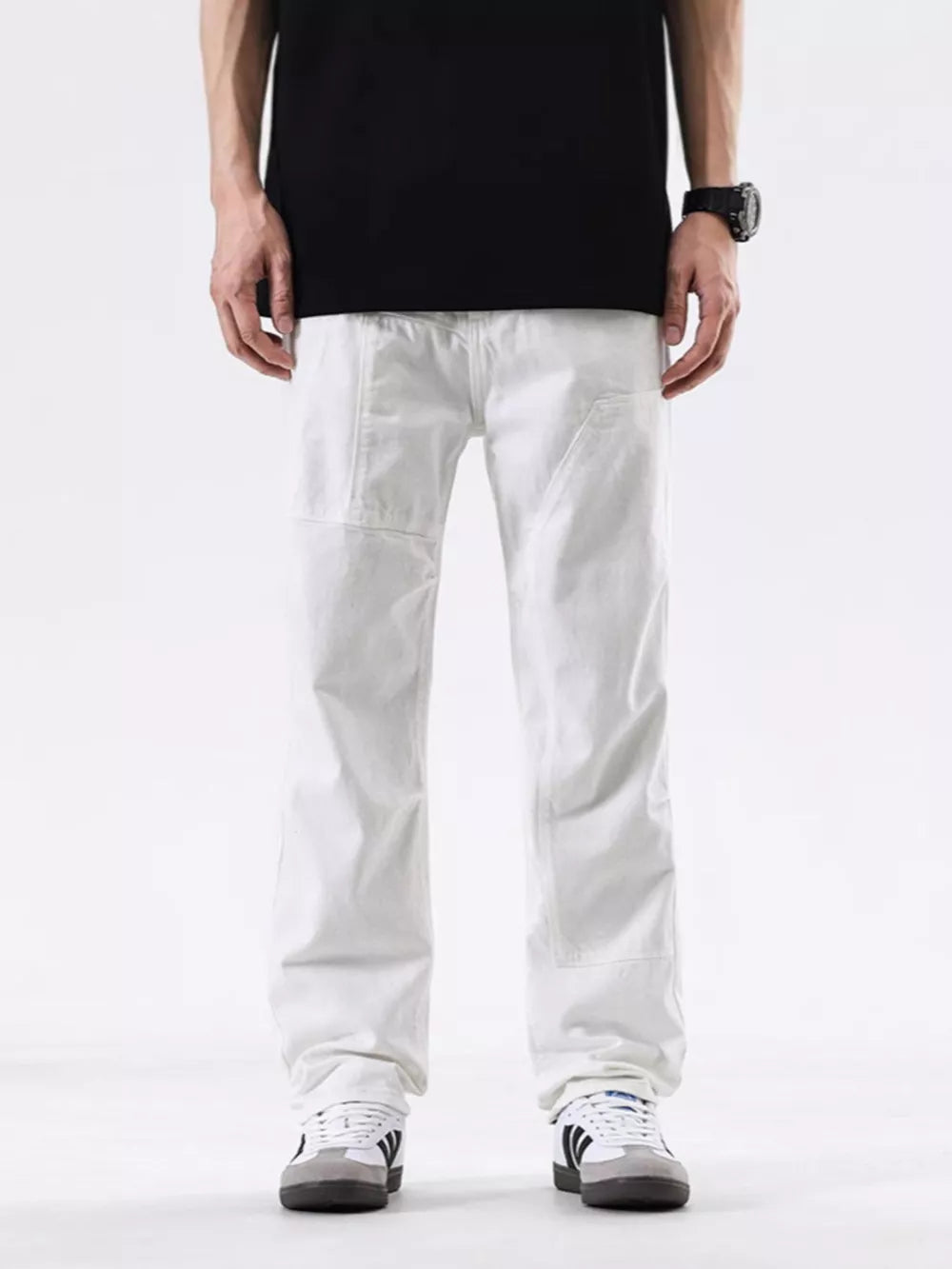 Men's white cotton jeans with a casual fit and pocketed design.
