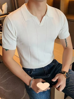 Ivory textured knit polo shirt with vertical ribbing and short sleeves.