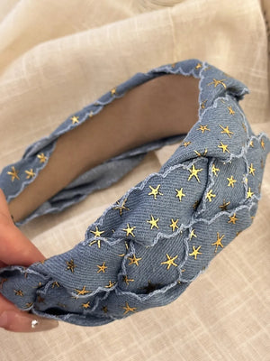 Braided denim headband with gold stars and frayed edge detail