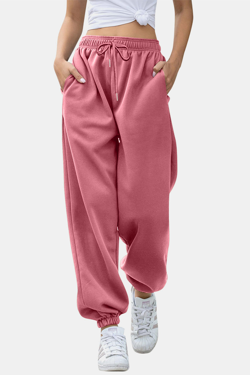 Dusty pink sweatpants with gathered cuffs and drawstring waist.