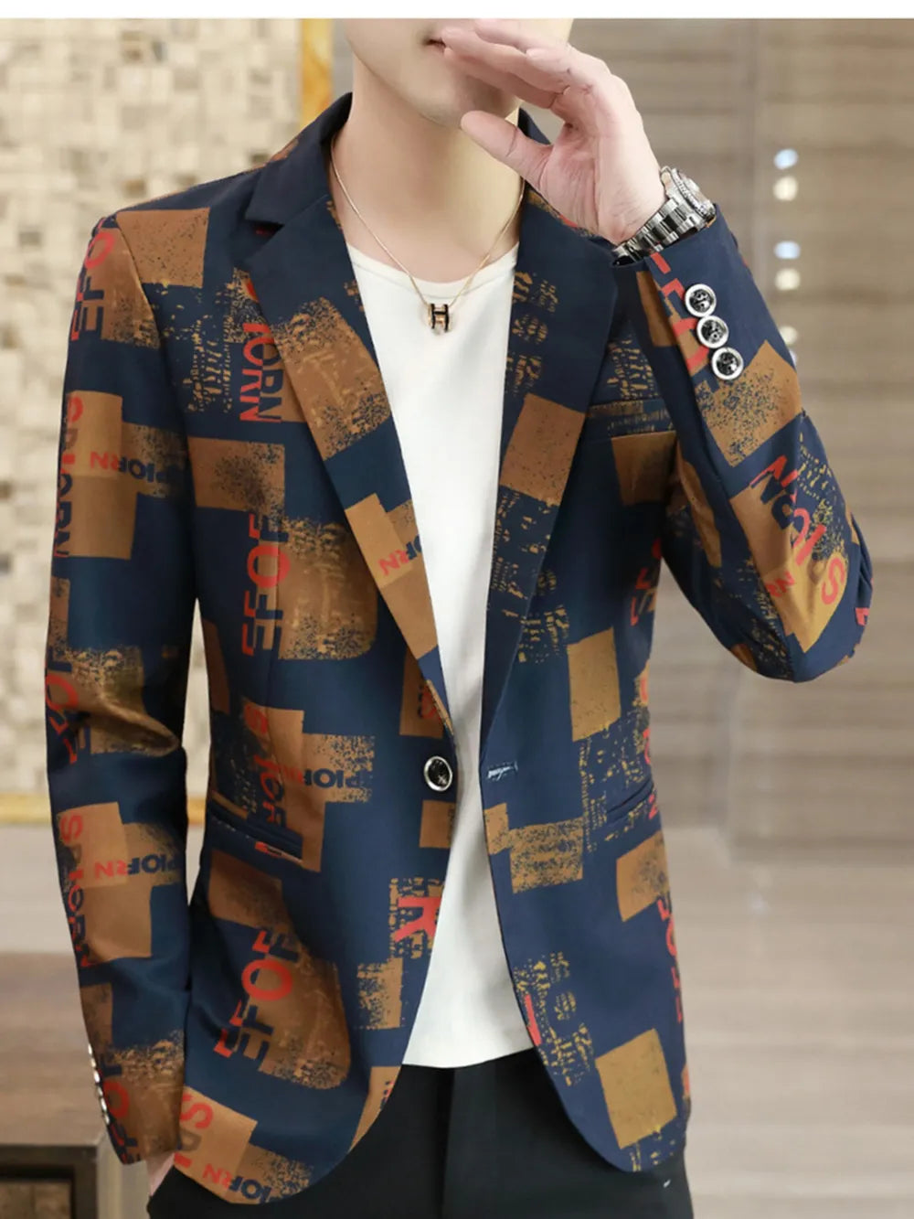 Men's slim fit blazer with abstract print in navy, brown, and red.