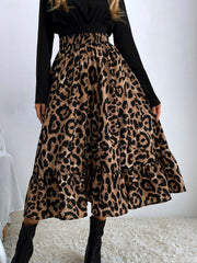 Leopard print tiered midi skirt with elastic waistband and ruffled hem.