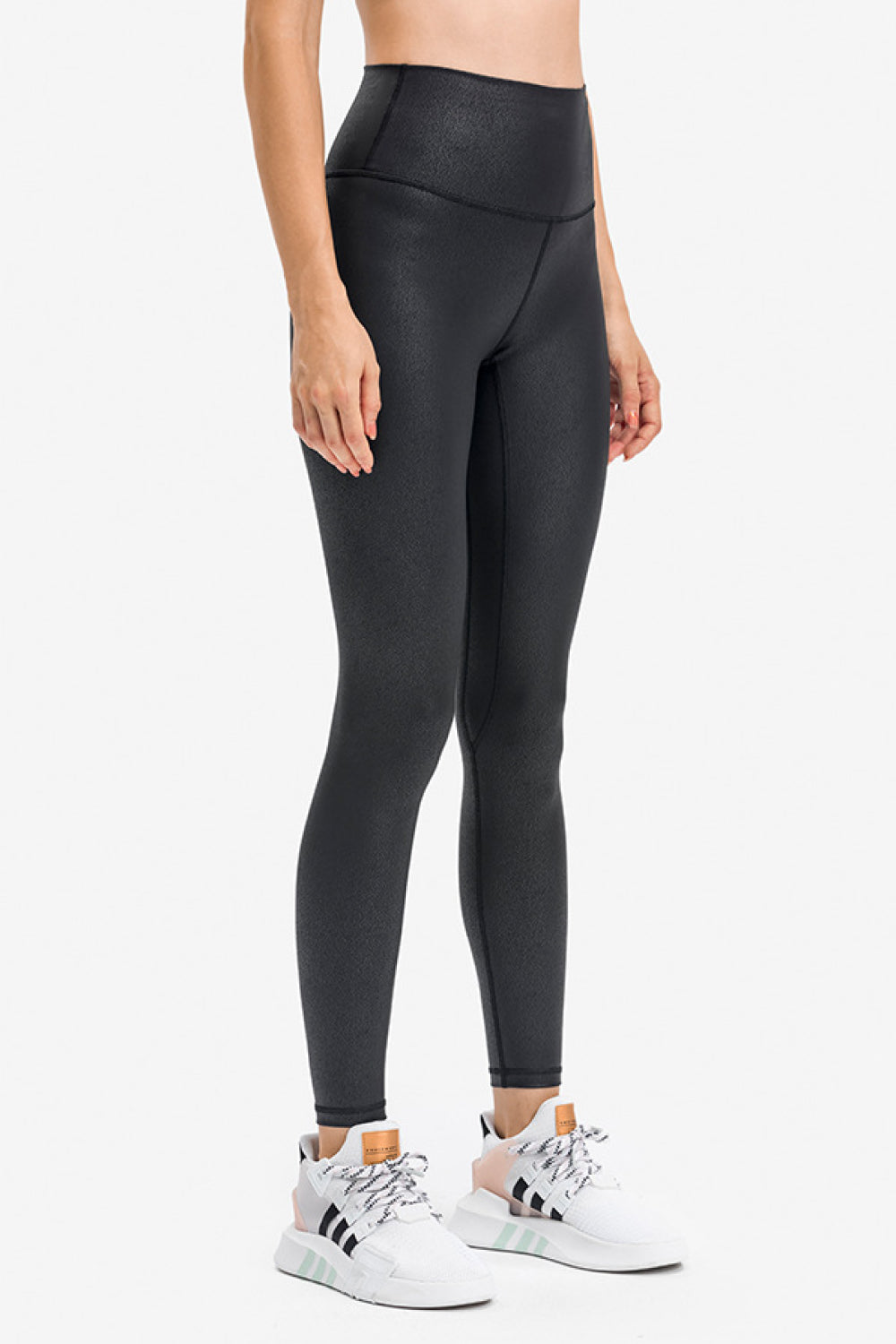 Black textured high-waisted activewear leggings with a fitted silhouette.