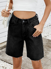 Black longline denim cutoff shorts with a raw hem