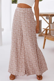 Polka dot wide leg culottes in dusty pink with a high waist.