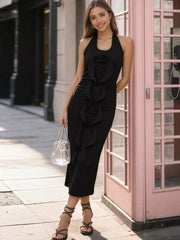 Elegant halter ruffle midi dress in black with ruched bodice and rose detail.