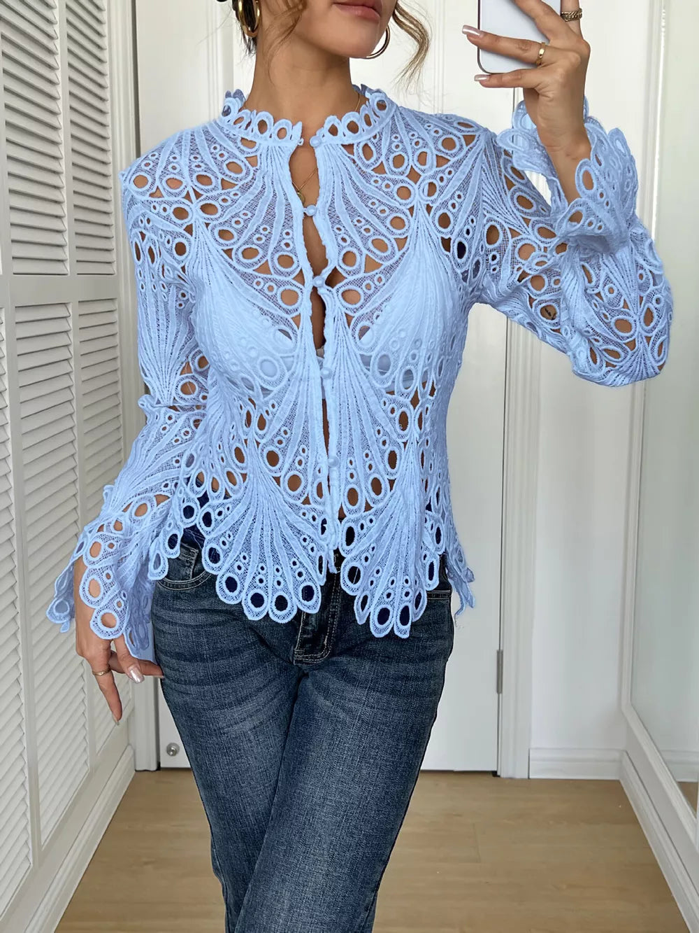 Blue lace button-up blouse with scalloped collar and bell sleeves.