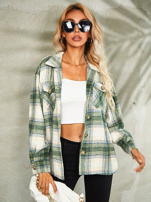 Collared green plaid jacket with button front and chest pockets, worn open over a white crop top.