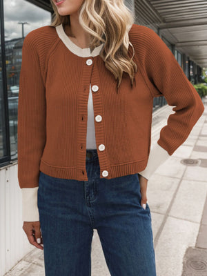 Brown raglan sleeve knit cardigan with white collar and cuffs, button front closure.