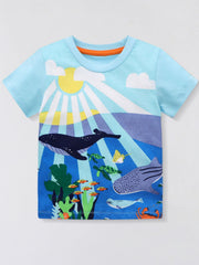 Pastel blue crew neck t-shirt with an underwater adventure graphic featuring whales, turtles, fish, and a crab.