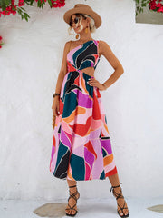 Abstract cutout midi dress with one-shoulder design and colorful geometric print