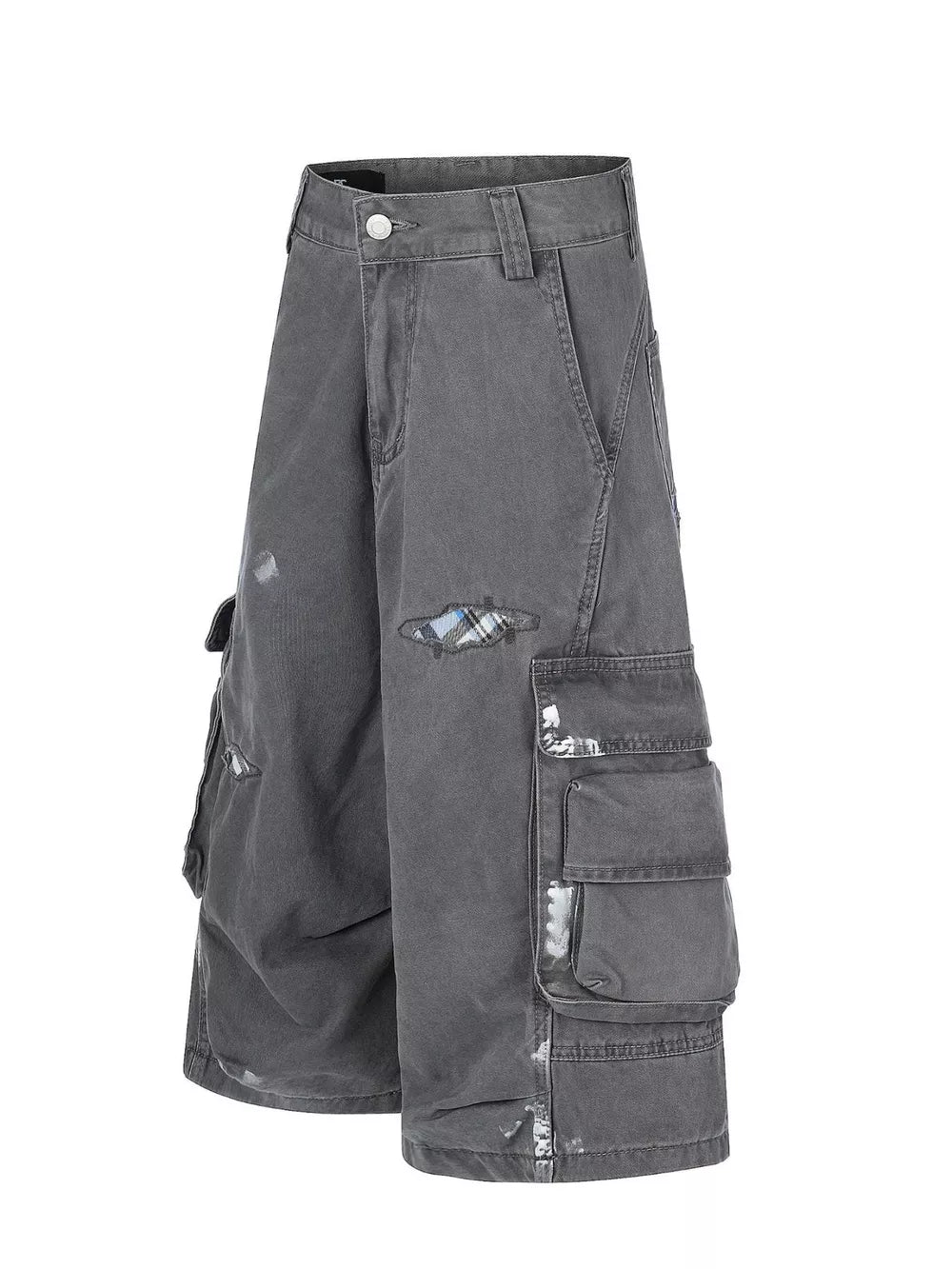 Gray cargo capris with distressed detailing and plaid patches.