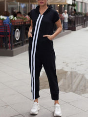 Black sporty tracksuit jumpsuit with hood and white side stripes.