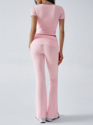 Blush pink loungewear set with ruched waistband and flared pants.