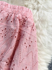 Pink eyelet maxi skirt with elastic waistband and embroidered detail
