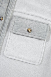 Light Gray cotton utility vest with contrast trim and button-down chest pocket.