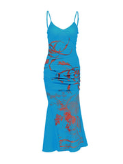 Blue spaghetti strap maxi dress with botanical print and ruched sides