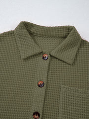 Moss waffle-knit collared shirt with button detail and chest pocket.