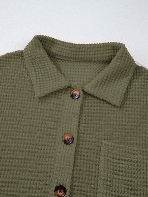 Moss waffle-knit collared shirt with button detail and chest pocket.