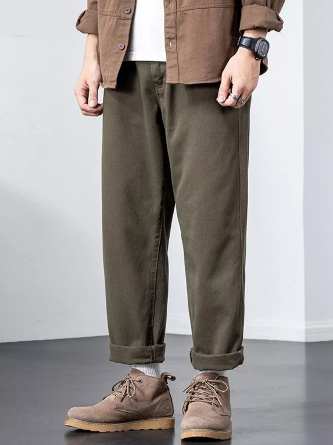 Plus-size army green cotton wide-leg trousers with cuffed hems.
