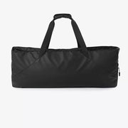 Black color block travel bag with dual handles and a zippered side pocket.