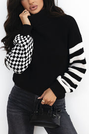 Black acrylic turtleneck sweater with checkerboard and stripe sleeves