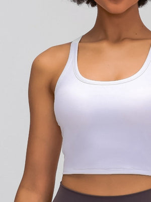 White sculpted racerback crop tank with a scoop neckline and seamless hem.