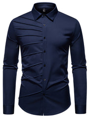 Navy blue cotton long sleeve shirt with asymmetrical ruched detail and button front.