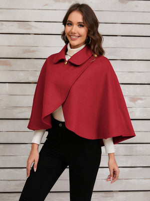 Deep Red asymmetric button-front cape jacket with a collar and gold buttons.