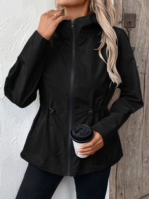 Black utility jacket with cinched waist, drawstring detail, and full zip closure.