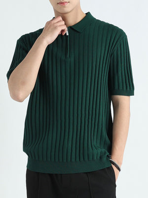 Dark green ribbed knit polo shirt with quarter zip and short sleeves.